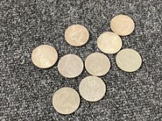Nine $1 coins
