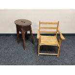 An oak stool together with a folding child's armchair