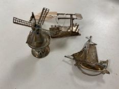 Three pieces of continental silver; windmill, bridge and junk boat,