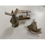 Three pieces of continental silver; windmill, bridge and junk boat,