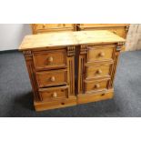 A pair of contemporary pine three drawer bedside chests