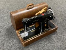 An oak cased vintage Singer sewing machine