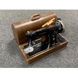 An oak cased vintage Singer sewing machine