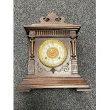An antique American 8 day mantel clock by The Ansonia Clock Company with pendulum and key