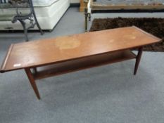 A mid century teak two tier coffee table