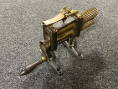 A nineteenth century brass and cast iron crimping machine