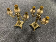 A pair of ornate three way table candelabra