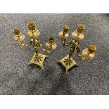A pair of ornate three way table candelabra