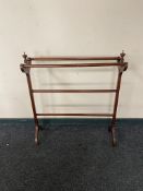 An Edwardian mahogany towel rail CONDITION REPORT: 85cm long by 25cm wide by 94cm
