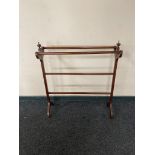 An Edwardian mahogany towel rail CONDITION REPORT: 85cm long by 25cm wide by 94cm