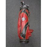 A Dunlop golf bag containing clubs