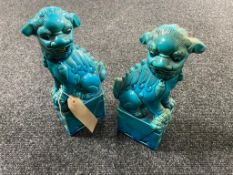 A pair of pottery Chinese foo dogs,