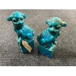 A pair of pottery Chinese foo dogs,