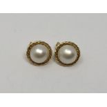 A pair of 18ct gold mabe pearl earrings.