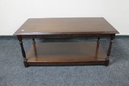 A rectangular oak coffee table with undershelf