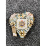 A heart shaped sweetheart pin cushion,