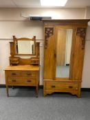 An Edwardian satin walnut mirrored wardrobe and three drawer dressing chest