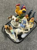 A tray of seven continental figurines, cobbler, blacksmith,
