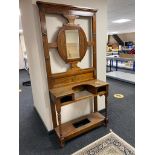 An Edwardian carved mahogany mirrored hall stand