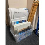 A box of art supplies, canvas, papers, easel, brushes,