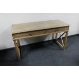 A twentieth century oak two drawer writing table CONDITION REPORT: 130cm wide by