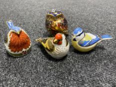 Four Royal Crown Derby bird paperweights with stoppers to include goldfinch, blue tit,