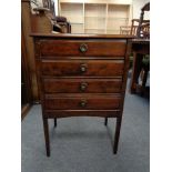 An Edwardian four drawer music cabinet