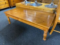 A rectangular pine coffee table,