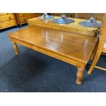 A rectangular pine coffee table,