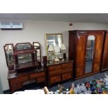 An Edwardian mahogany three piece bedroom suite - triple door wardrobe,