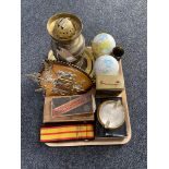 A tray of brass oil lamp, globe ornaments, ammunition shell,