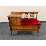 A twentieth century mahogany telephone table