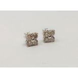 A pair of 18ct white gold diamond cluster earrings, approximately 1ct.