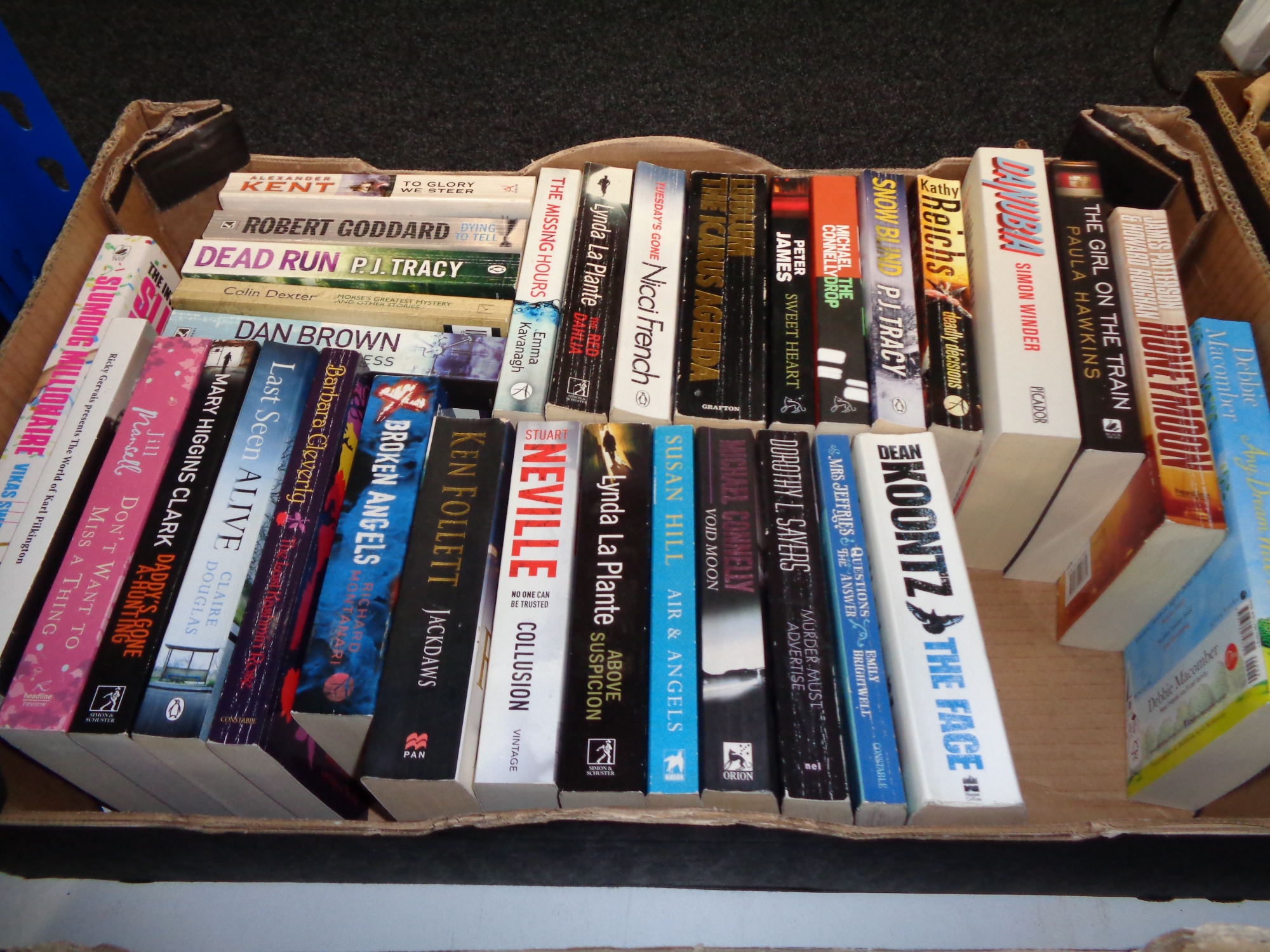 A box of paperback books; novels, Ken Follett,