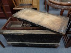 An antique pine joiner's tool box containing hand tools