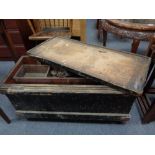 An antique pine joiner's tool box containing hand tools