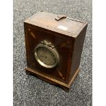 An antique inlaid mahogany mantel clock by Harvey of Newark