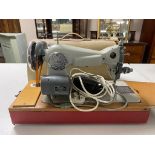 A cased Jones electric sewing machine