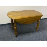 A twentieth century pine drop leaf kitchen table