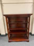 A set of reproduction mahogany open bookshelves