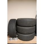 A set of four dynamix motor sports car wheels with Conti winter contact tyres