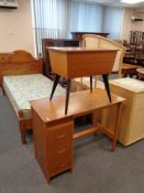 A mid century sewing box together with a single pedestal desk fitted with three drawers