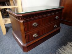 A reproduction inlaid mahogany entertainment stand