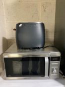 A Morphy Richards stainless steel microwave together with a Prestige toaster