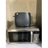 A Morphy Richards stainless steel microwave together with a Prestige toaster