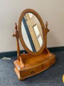 A contemporary toilet mirror fitted two drawers