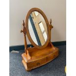 A contemporary toilet mirror fitted two drawers