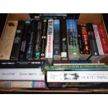 A box of hardback and paperback books; novels to include Martina Cole,