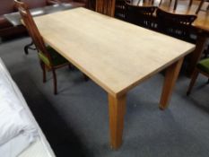 A pine farmhouse dining table, length 180 cm, width 90.5 cm.