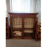 A Victorian mahogany double door glazed bookcase, width 146 cm.